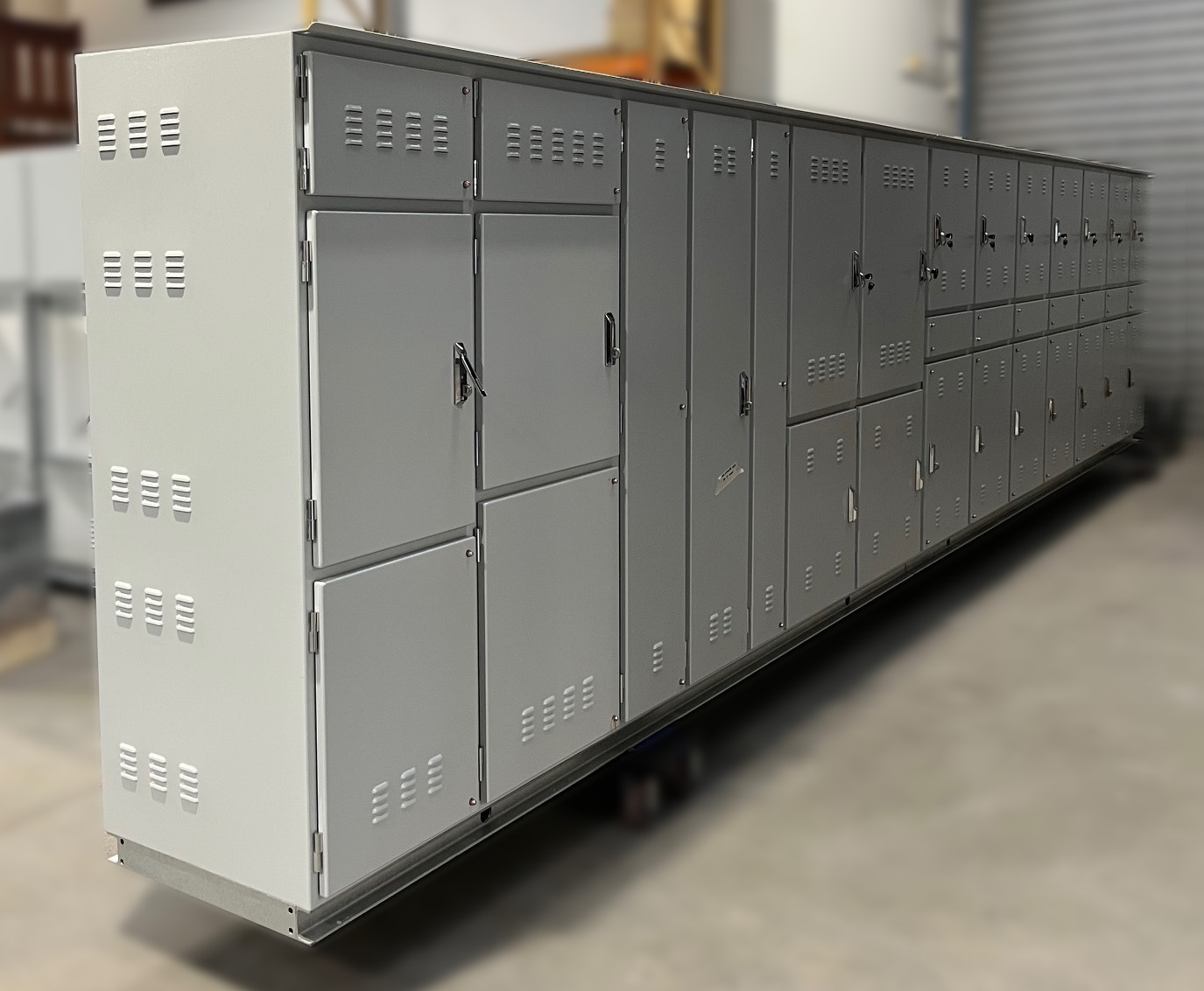 Large electrical switchboard engineered for a warehousing facility, featuring high-capacity breakers, load distribution modules, and clear labeling for lighting, HVAC, and equipment circuits