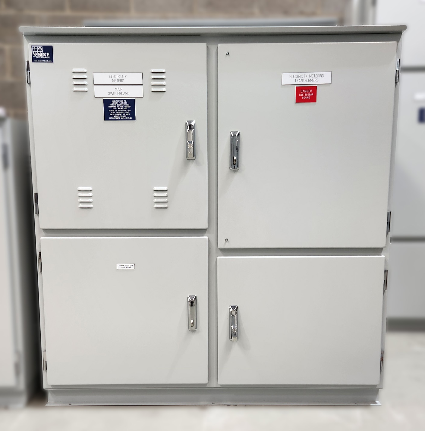 Compact electrical switchboard designed for an office building, enclosed in a sleek aluminium cabinet