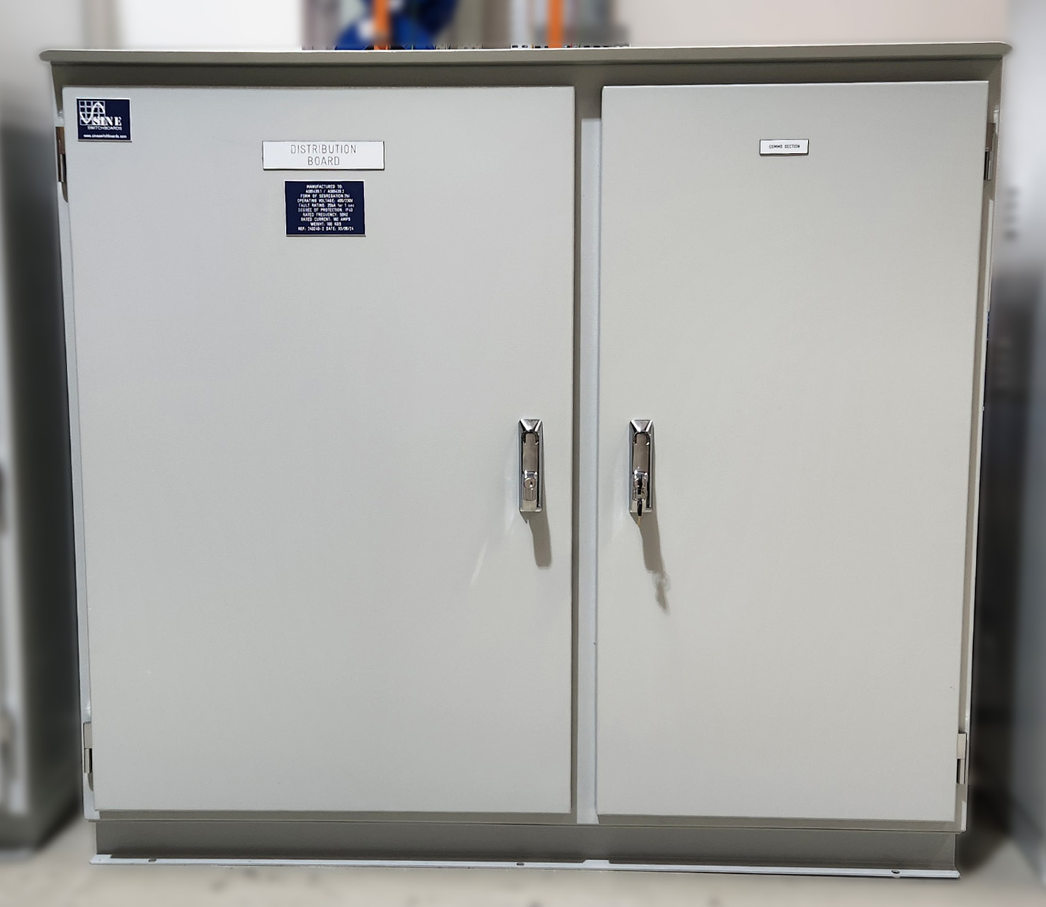 Free-standing electrical distribution board with front-access, modular breakers, and neatly organized internal wiring for commercial or industrial power distribution